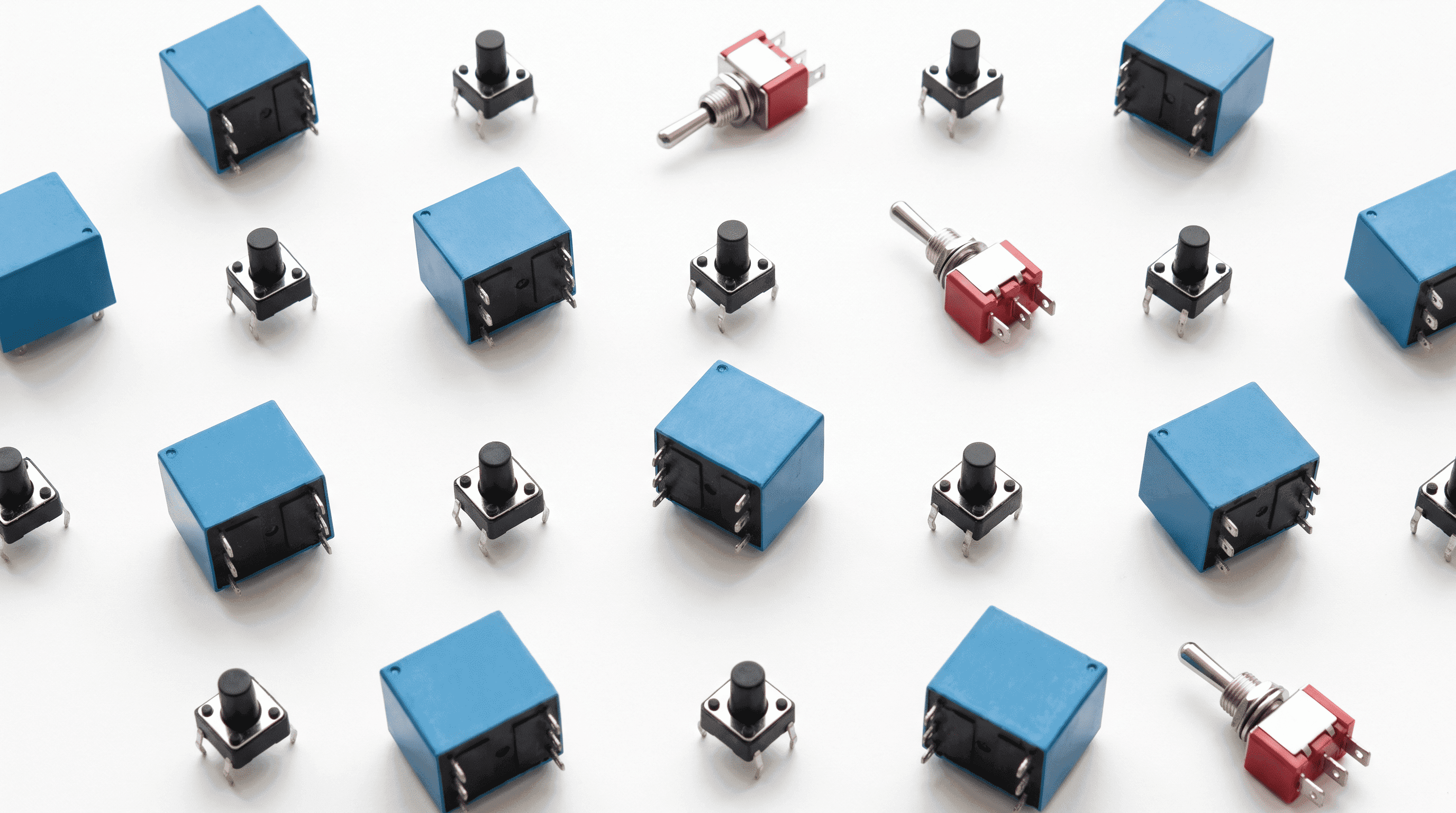 Blue electromagnetic relays, tactile switches and toggle switches flat-lay