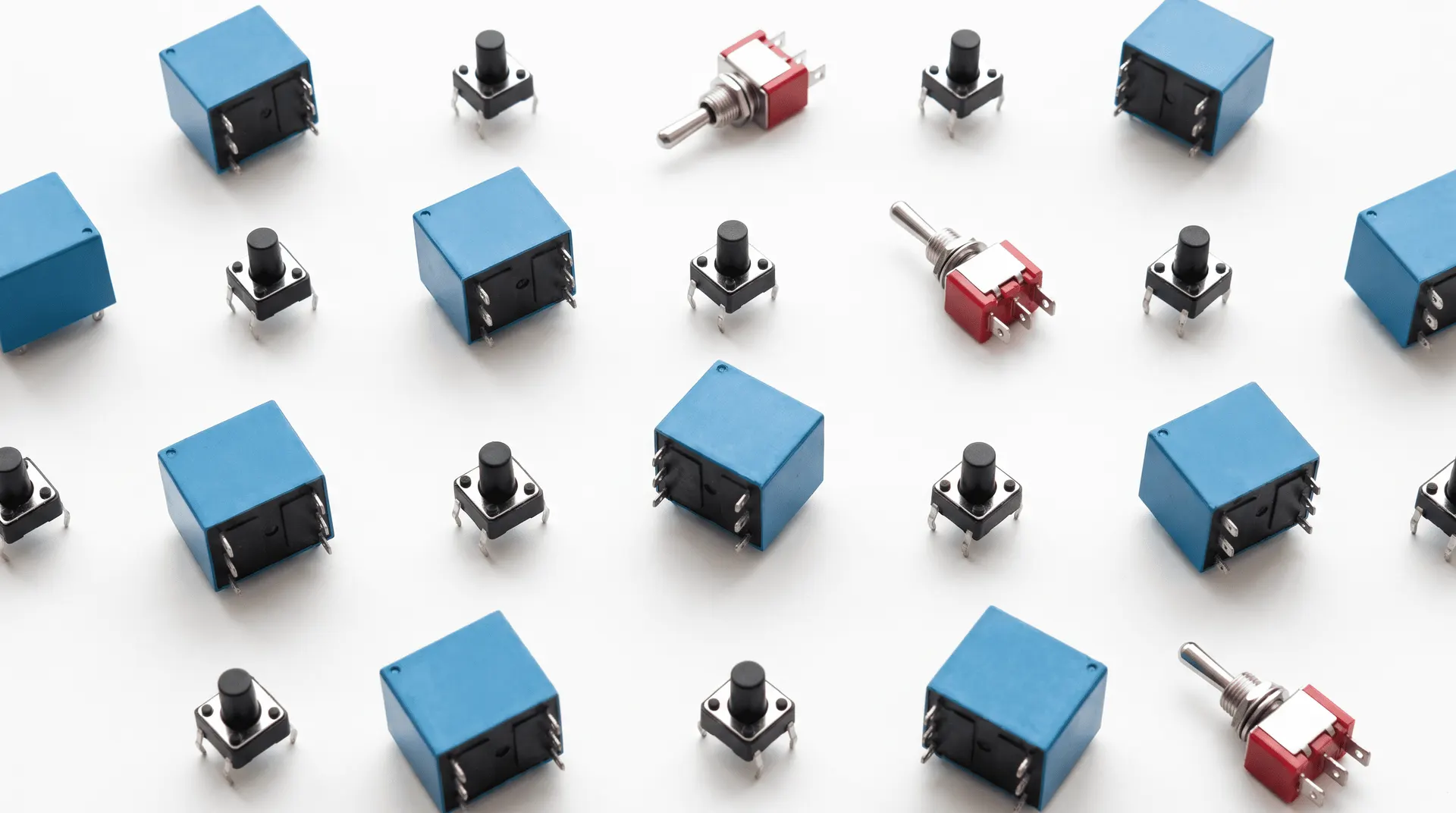 Blue electromagnetic relays, tactile switches and toggle switches flat-lay