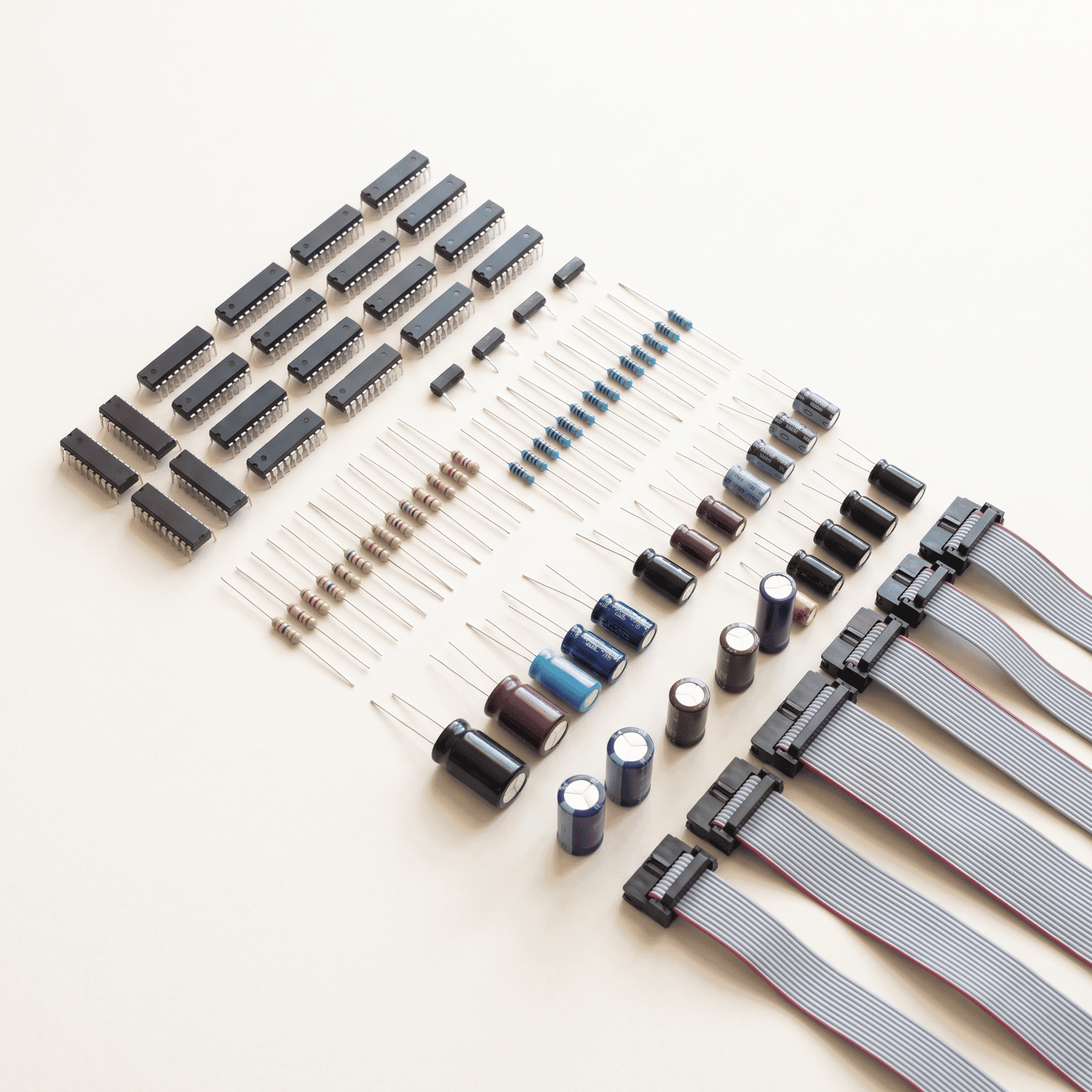 Orderly flat-lay of assorted electronic components arranged in rows